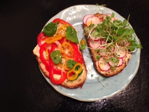 hummus veggie radish sprout sandwich